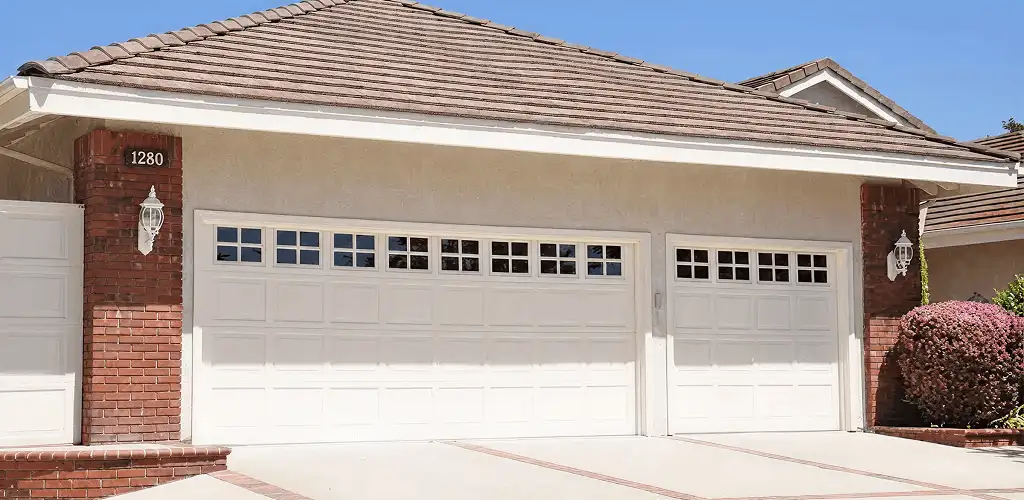 Residential garage door repair service for a double garage door in Marietta, GA
