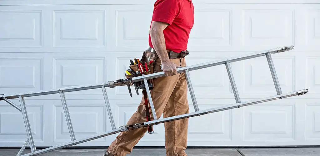 Garage door repair technician arriving with tools and ladder in Marietta, GA